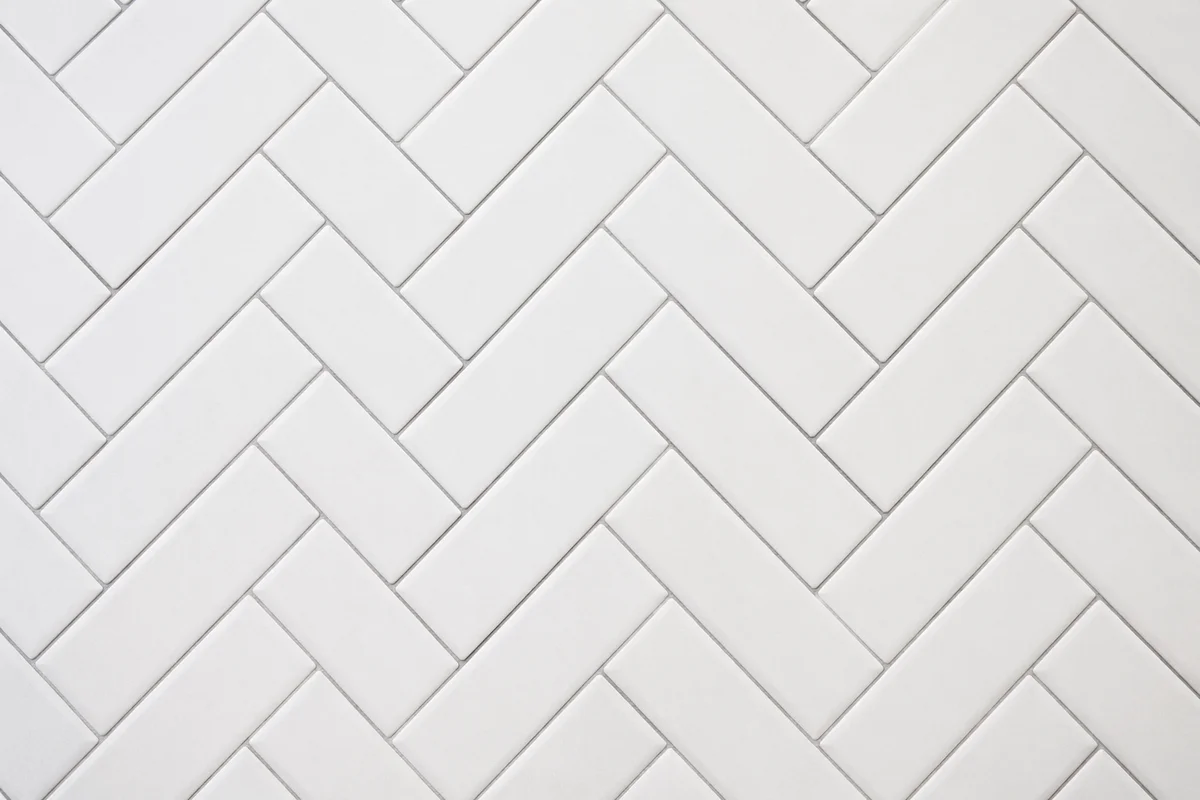 Clean White Herringbone Tile Background
