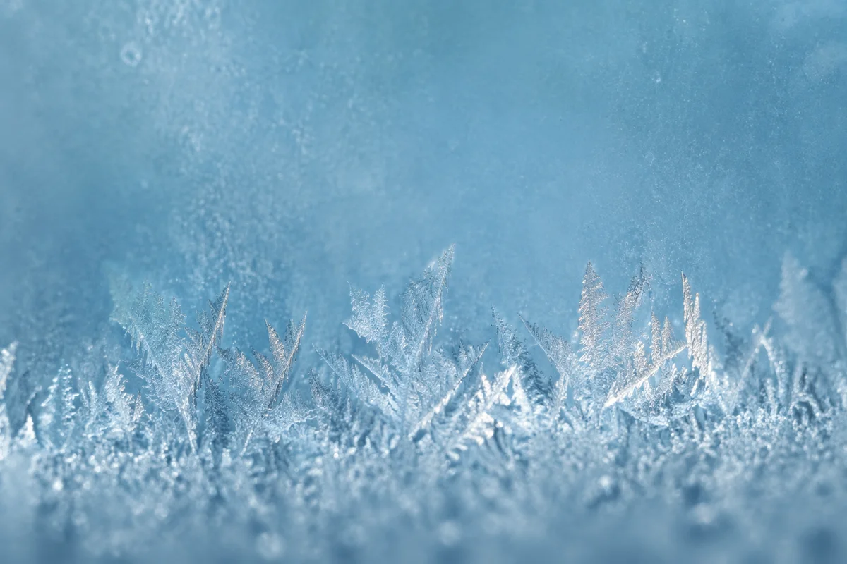 Winter Frost Crystals on Blue Glass