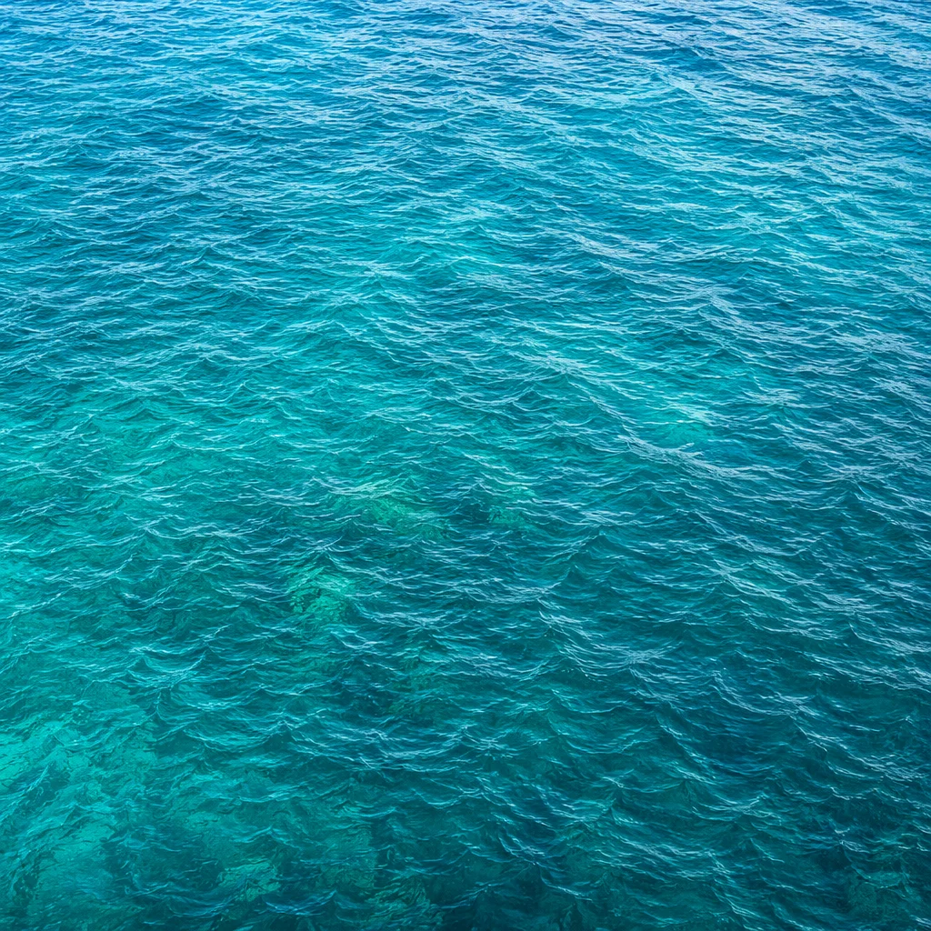 Turquoise Ocean Ripple Texture Overhead Background