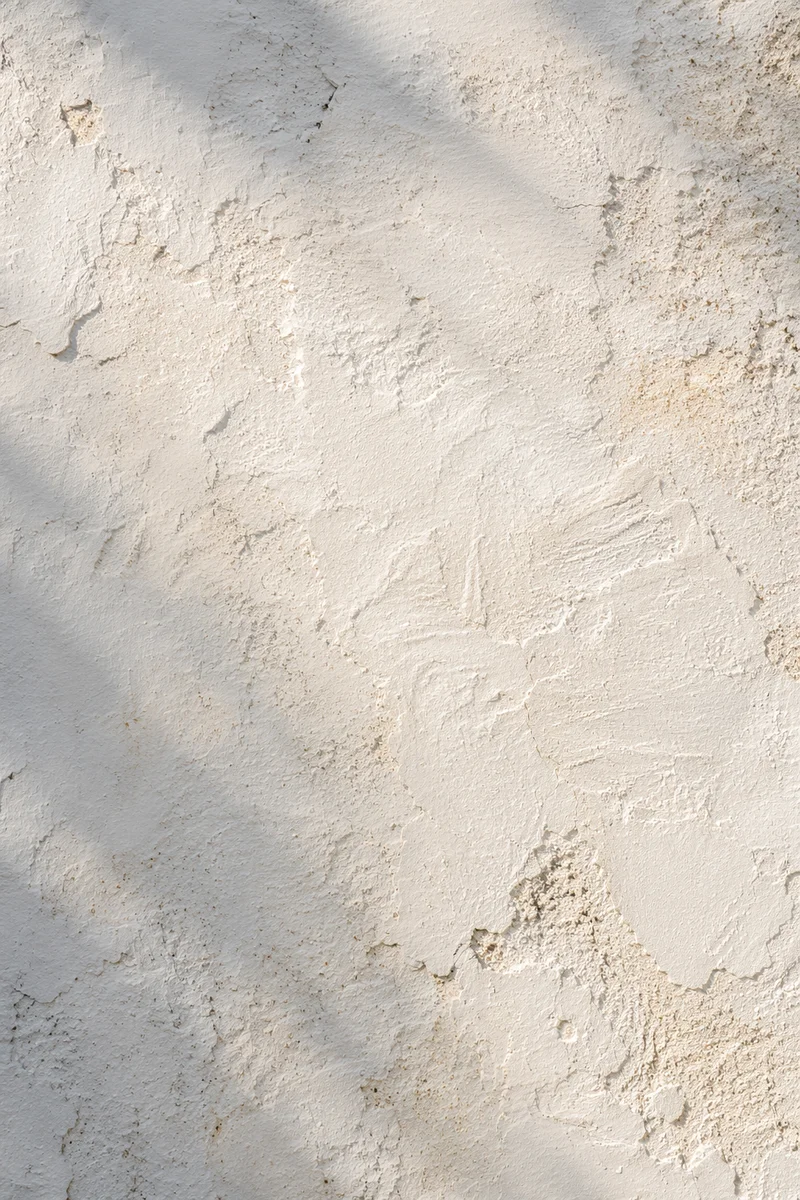 Weathered White Mediterranean Plaster Texture Background