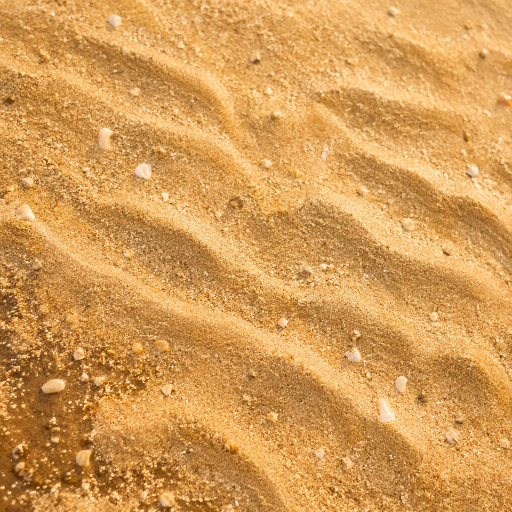 Warm Golden Beach Sand Texture Background
