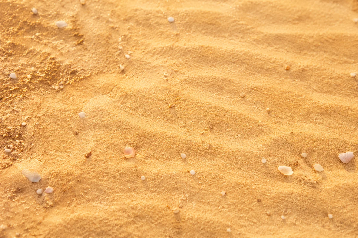 Warm Golden Beach Sand Texture Background
