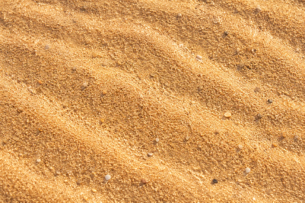 Warm Golden Beach Sand Texture Background