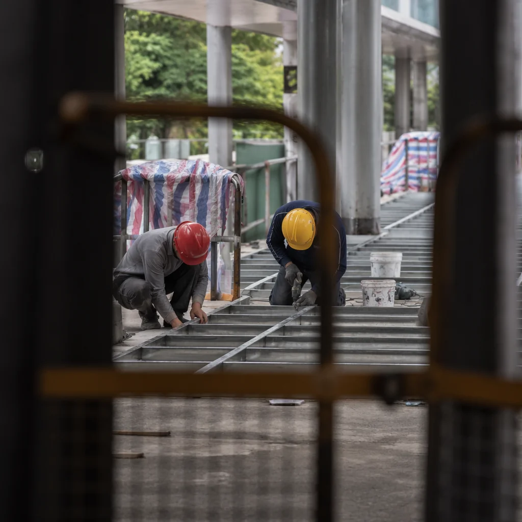 Construction Workers Installing Metal Floor Framing