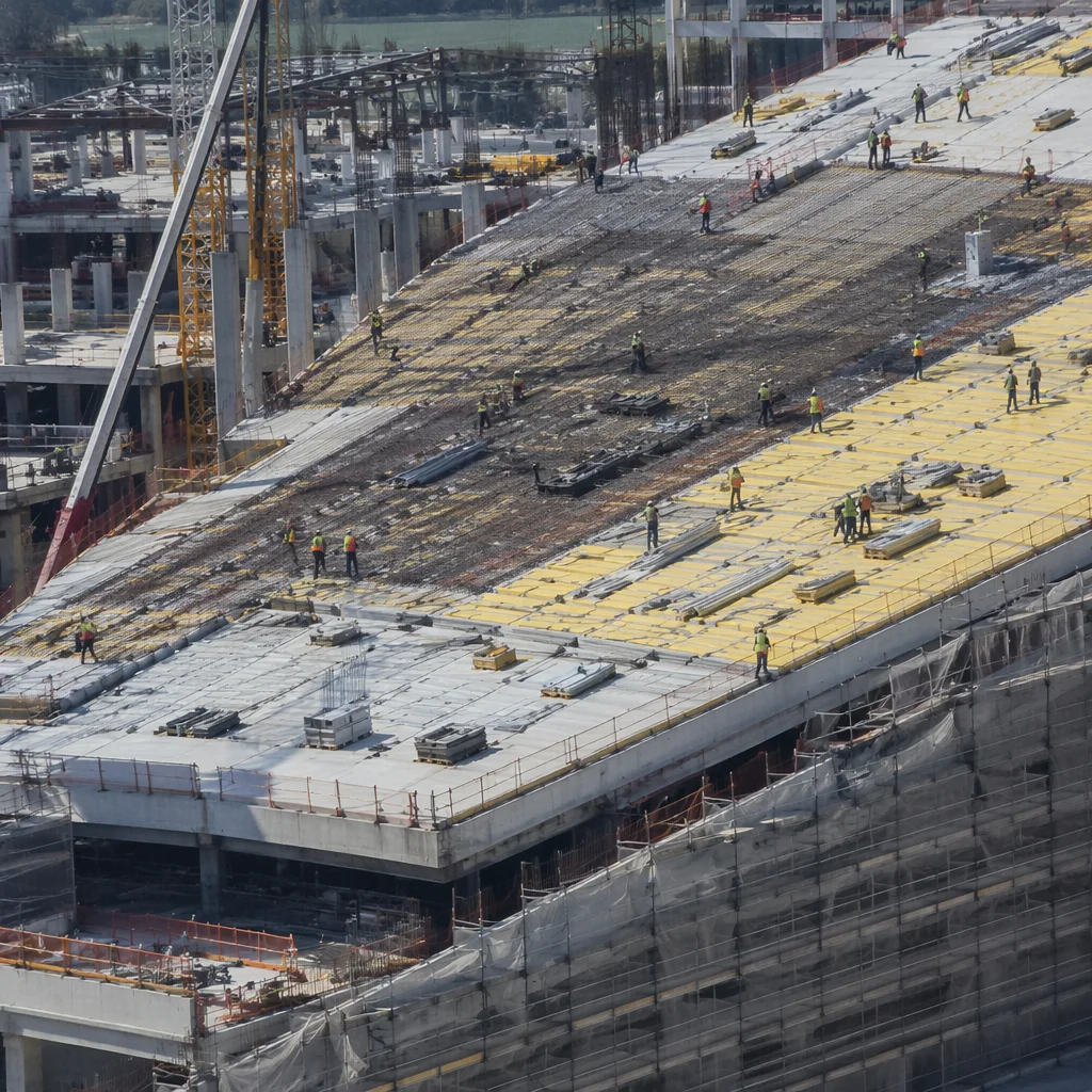 Urban Construction Workers on Concrete Roof Deck