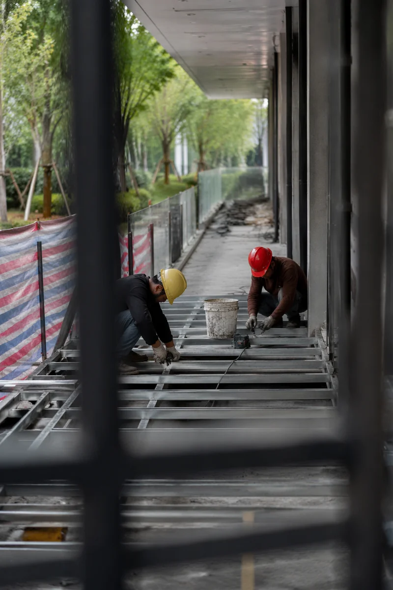 Construction Workers Installing Metal Floor Framing