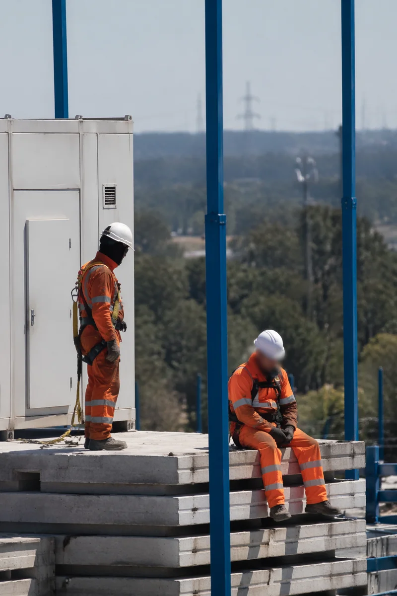 Construction Workers on Precast Concrete Slabs