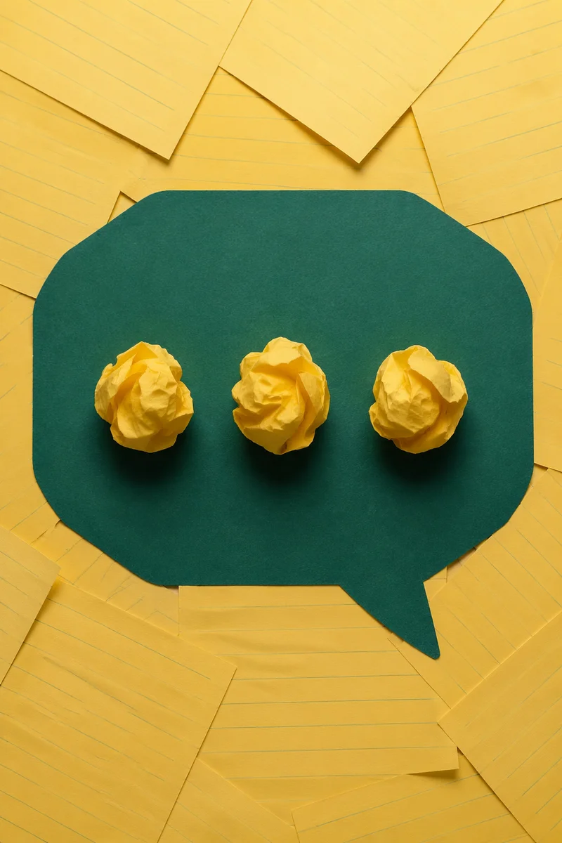 Crumpled Paper Ideas on Teal Desk