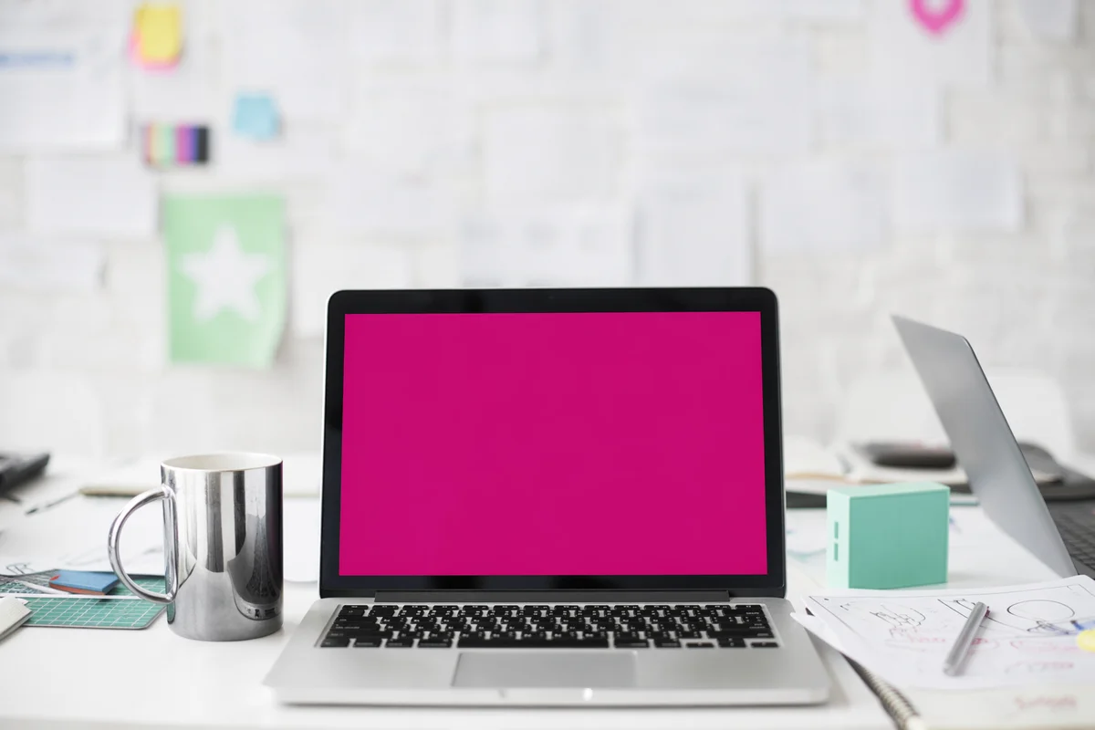Creative Startup Desk With Magenta Laptop