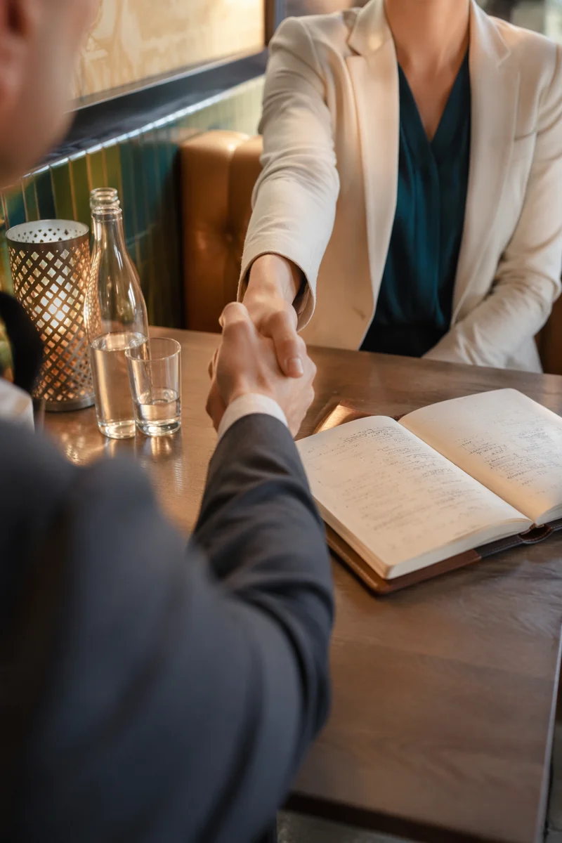 Professional Handshake Agreement in Cozy Café