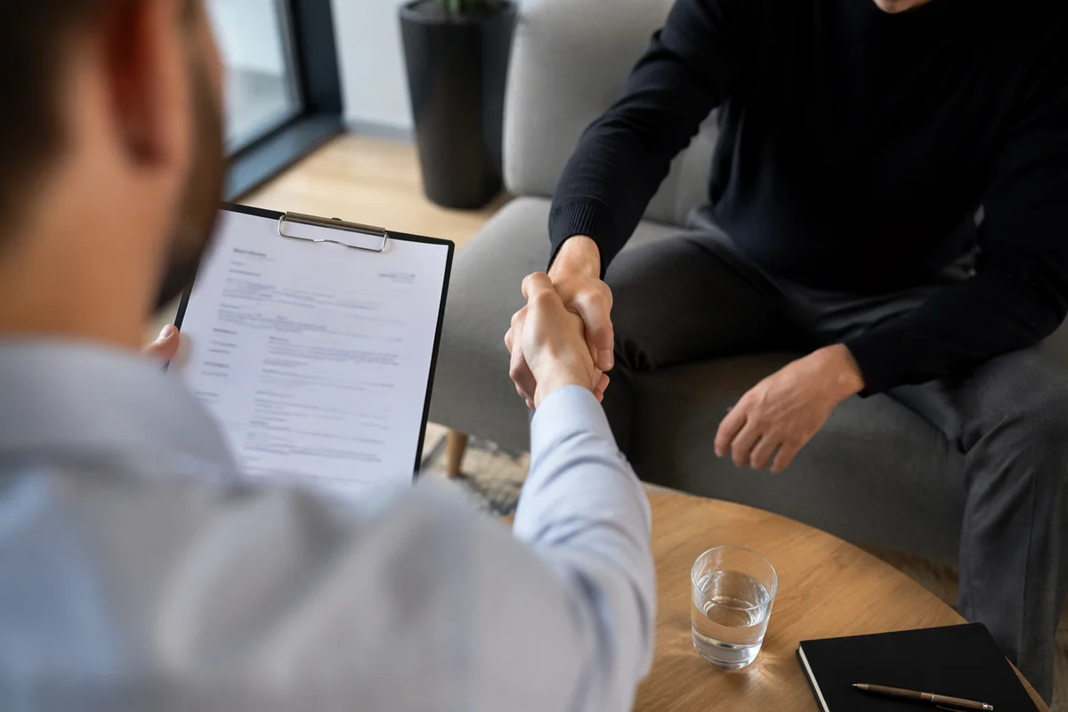 Job Interview Handshake in Modern Office