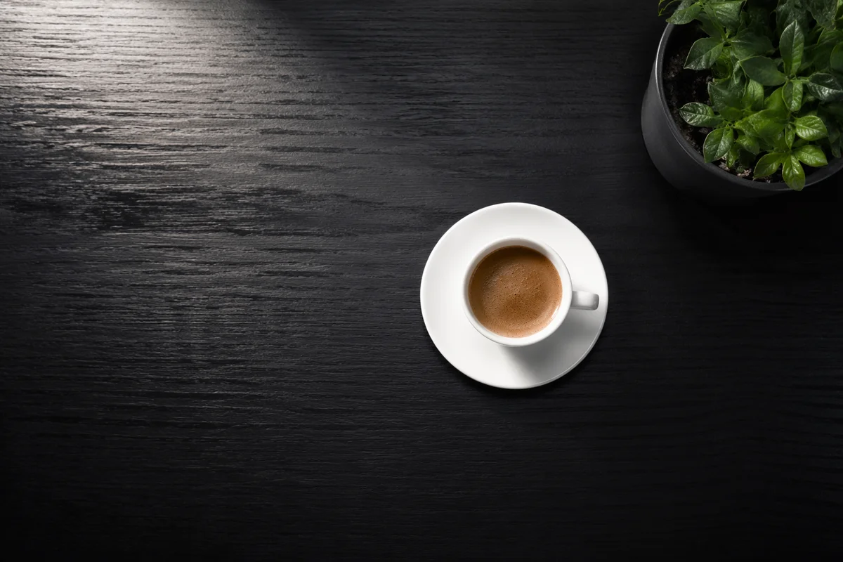 Minimalist Business Desk with Coffee and Plant