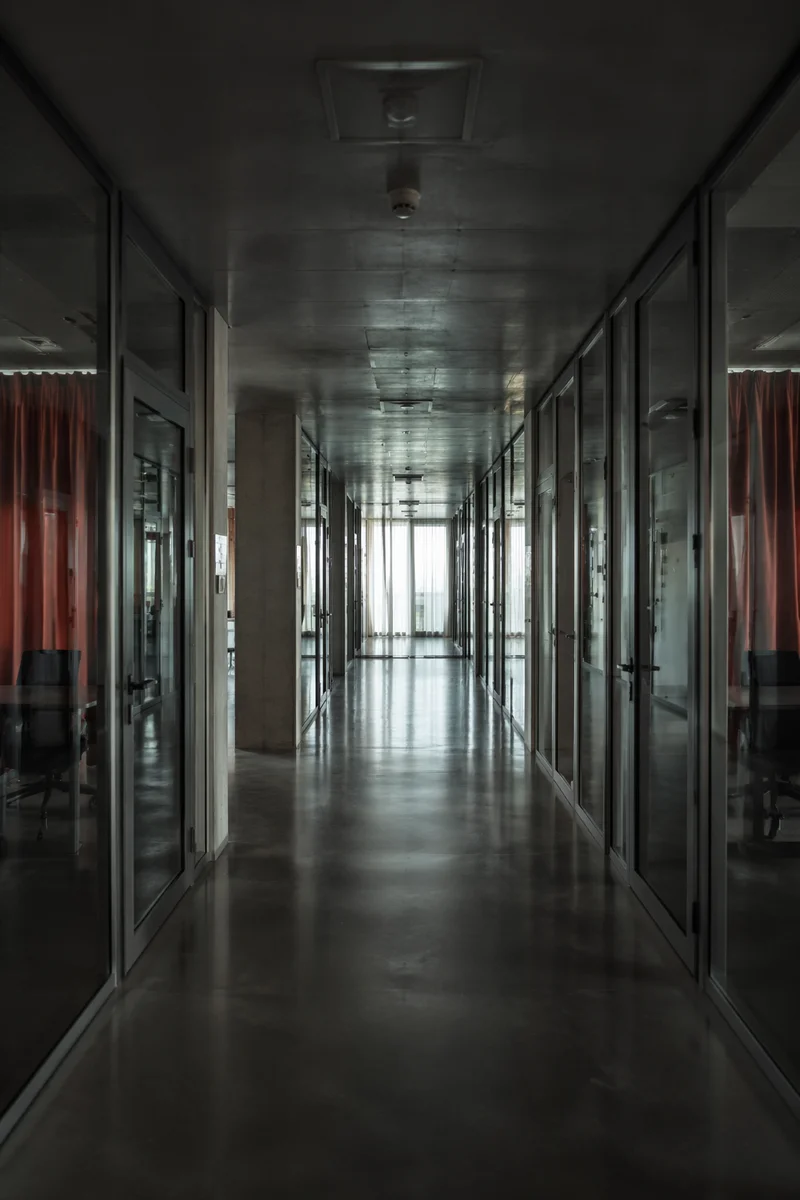 Empty Glass Office Corridor Perspective