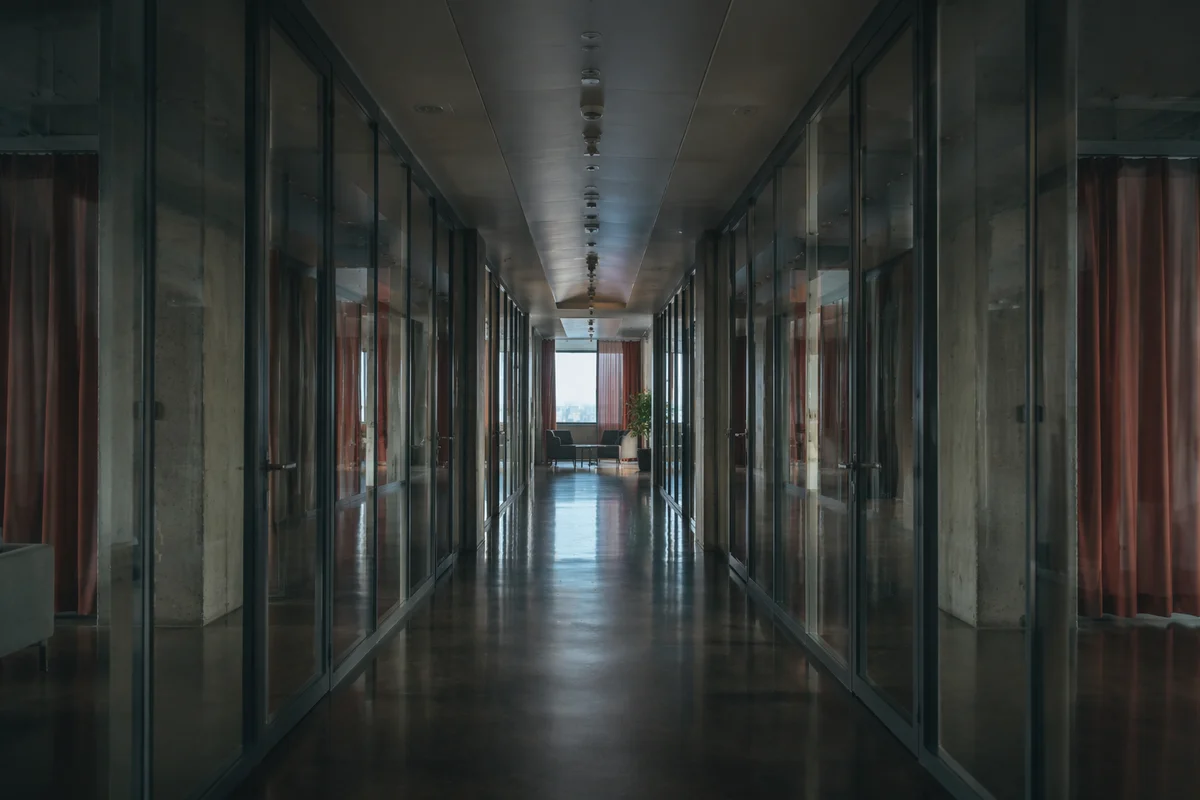 Modern Glass Office Corridor Perspective