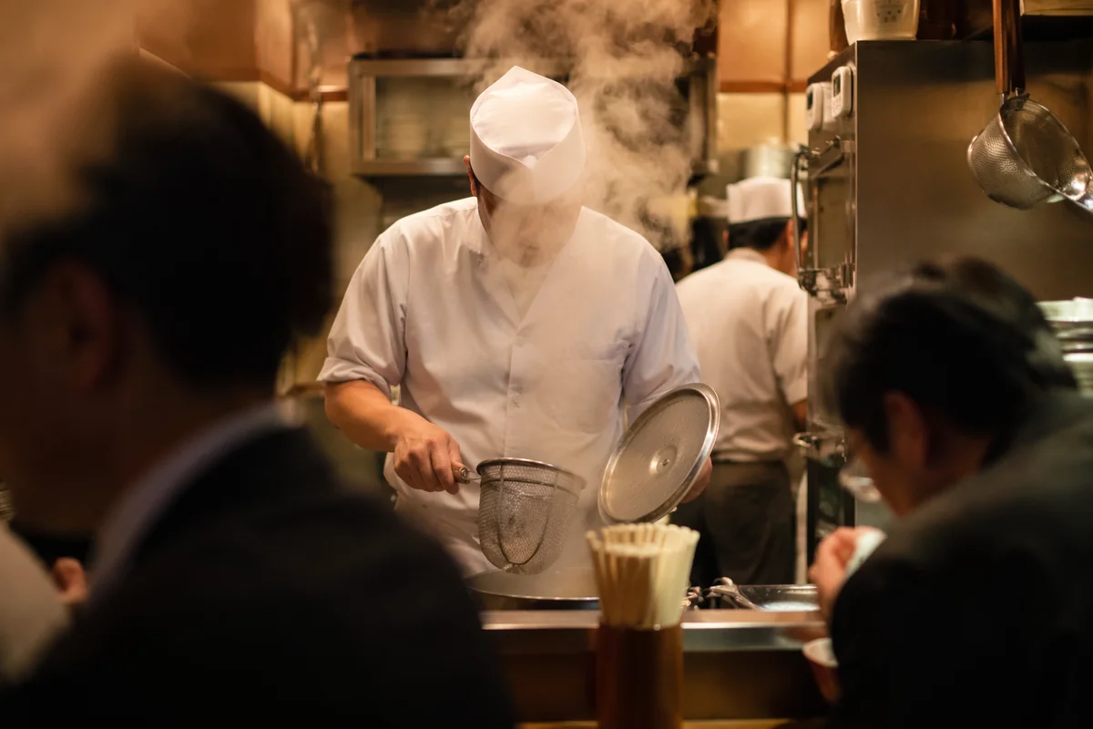 Busy Restaurant Chef in Steamy Kitchen