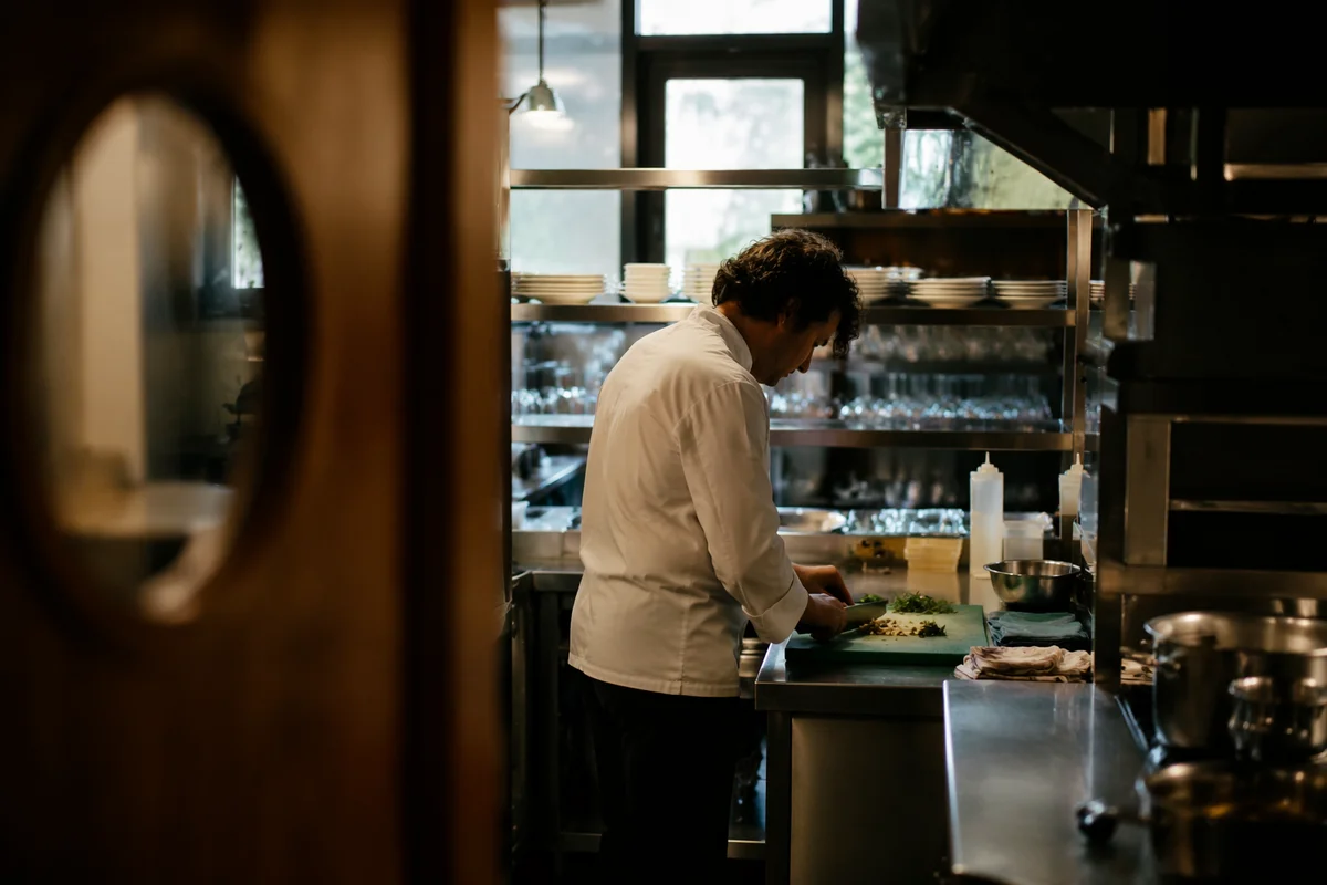 Chef Preparing Vegetables in Professional Kitchen