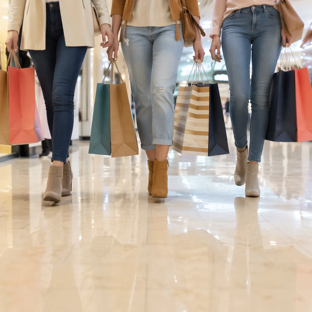 Modern Shoppers Carrying Colorful Retail Bags