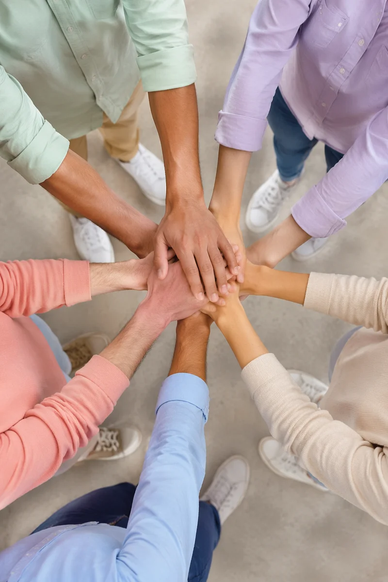Diverse Team Hands Stacked in Unity