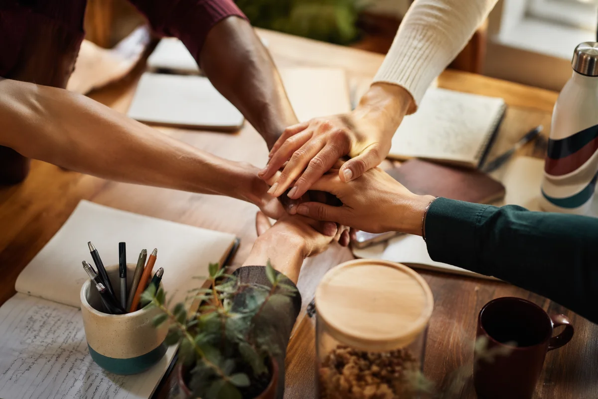 Overhead Team Hands in Office Unity