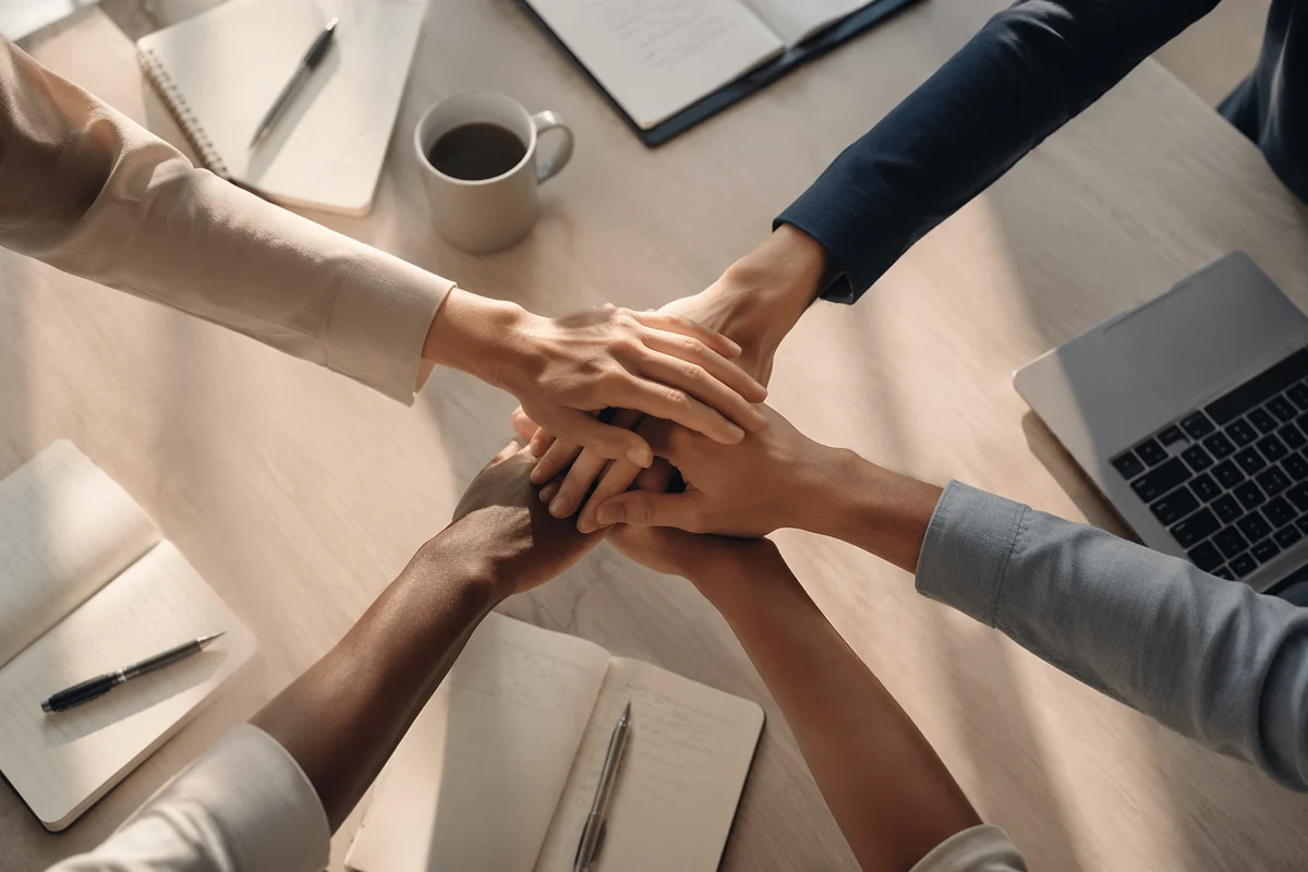 Business Team Hands Stacked in Unity