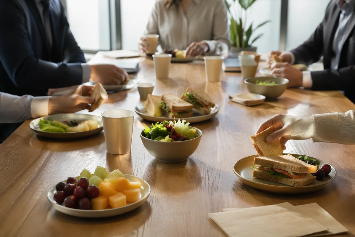 Business Team Lunch Meeting on Conference Table