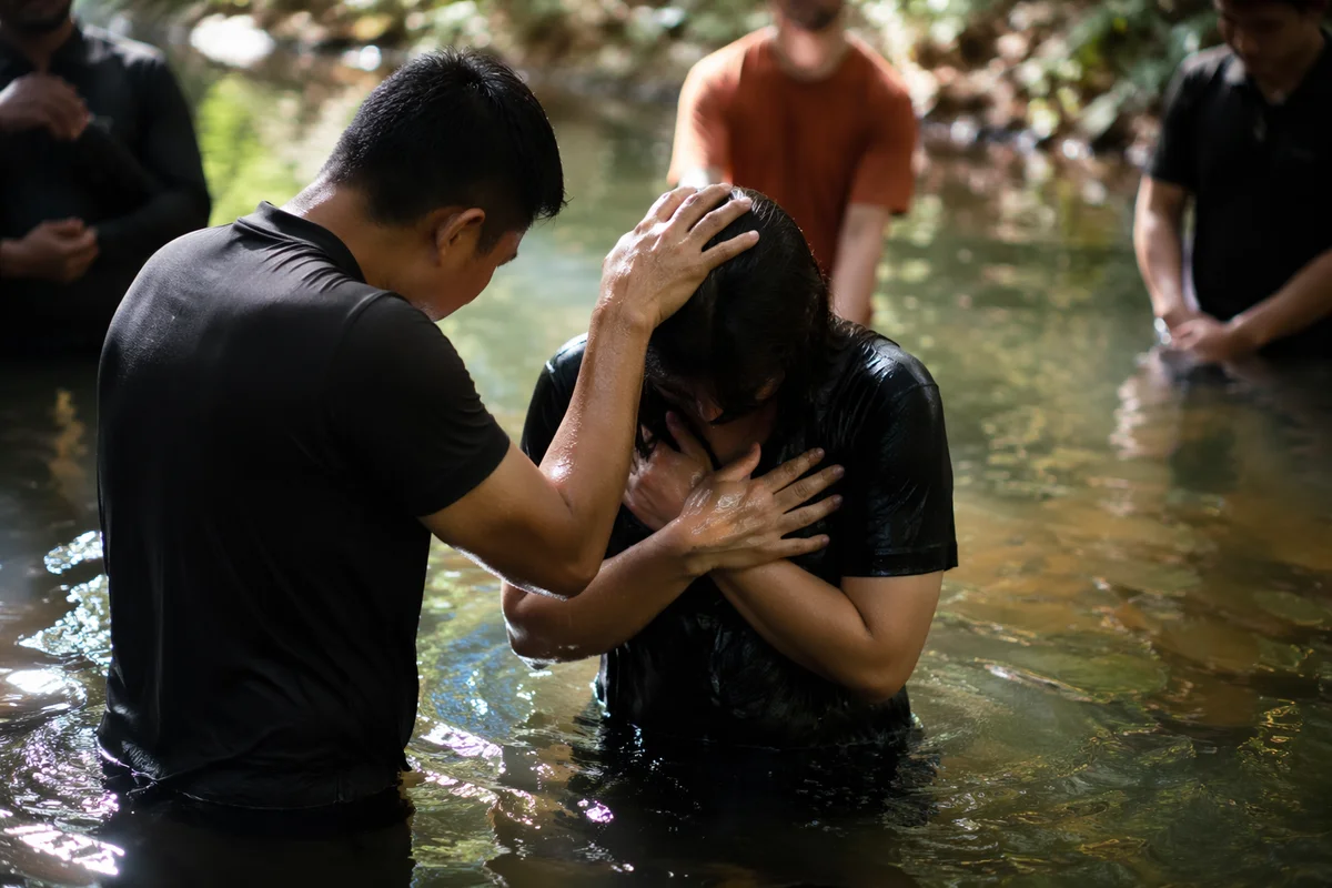 Reverent Outdoor River Baptism Gathering