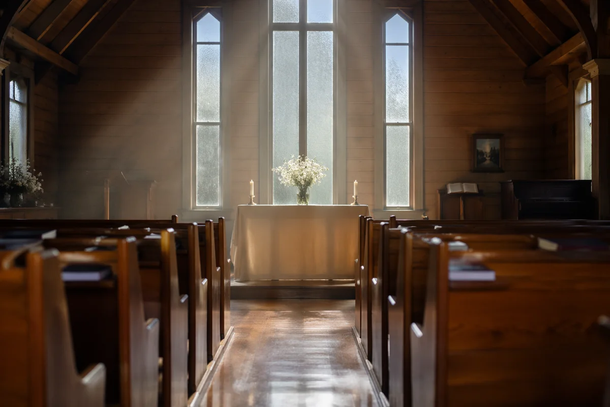 Quiet Chapel Aisle Toward Simple Altar