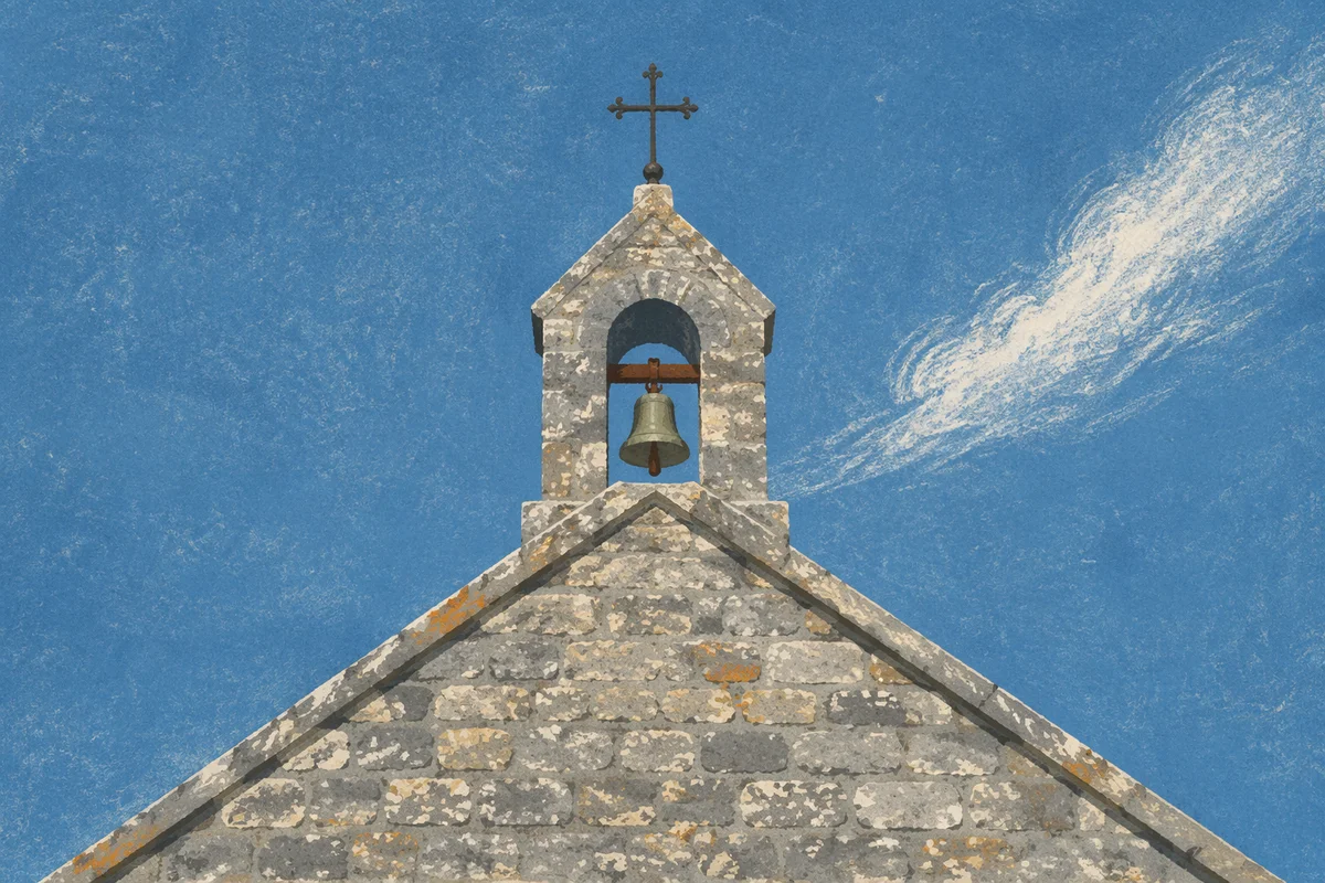 Old Stone Chapel Bell Tower Under Blue Sky