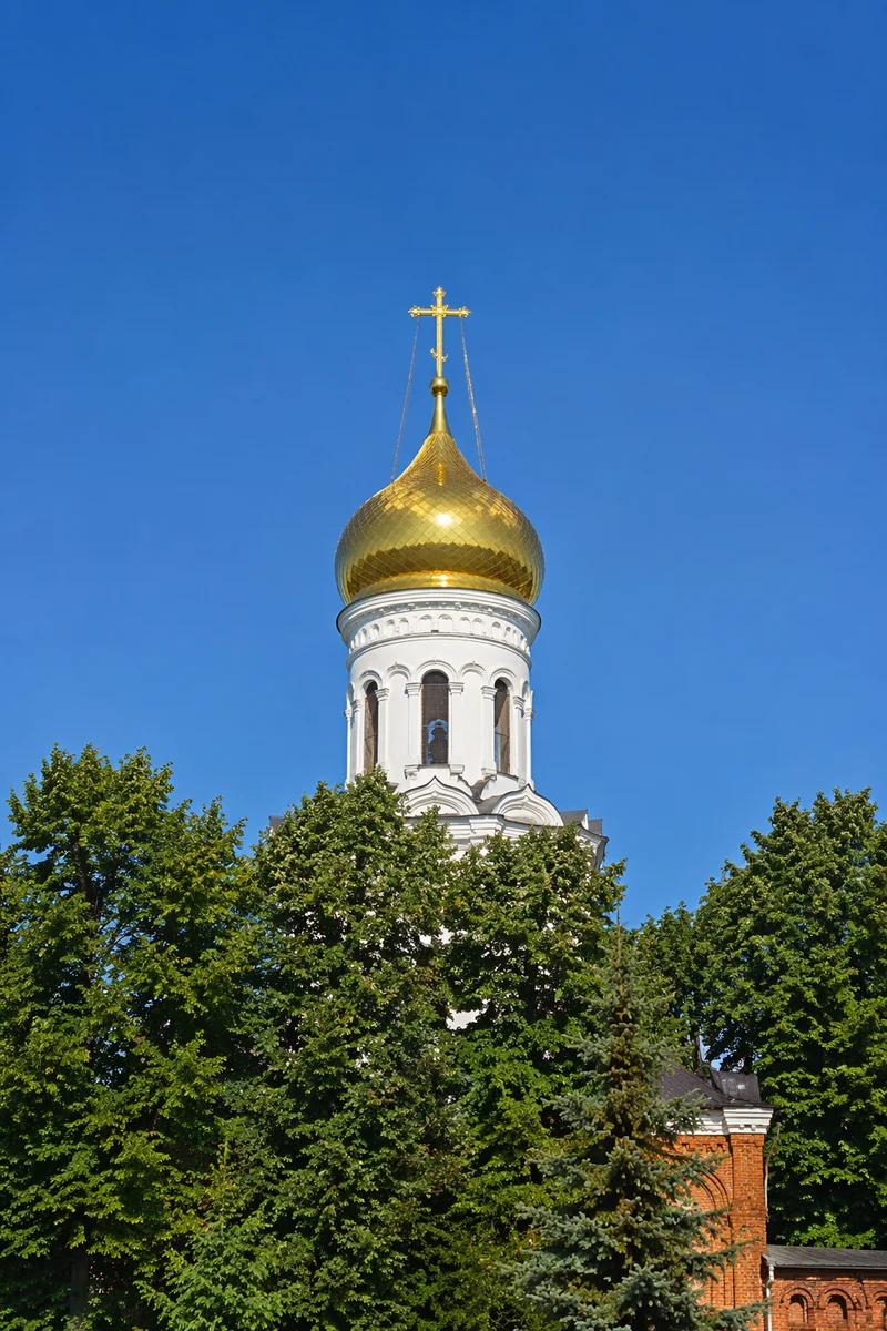 Golden Church Bell Tower Under Blue Sky