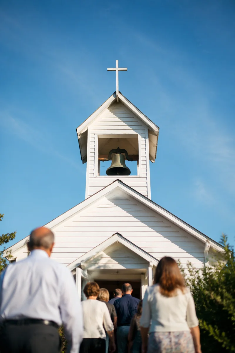 White Church Bell Tower Under Blue Sky