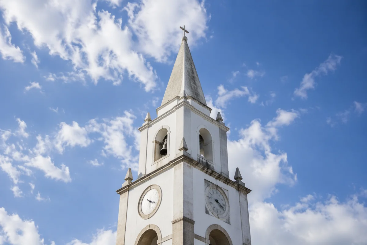 White Church Bell Tower Under Blue Sky