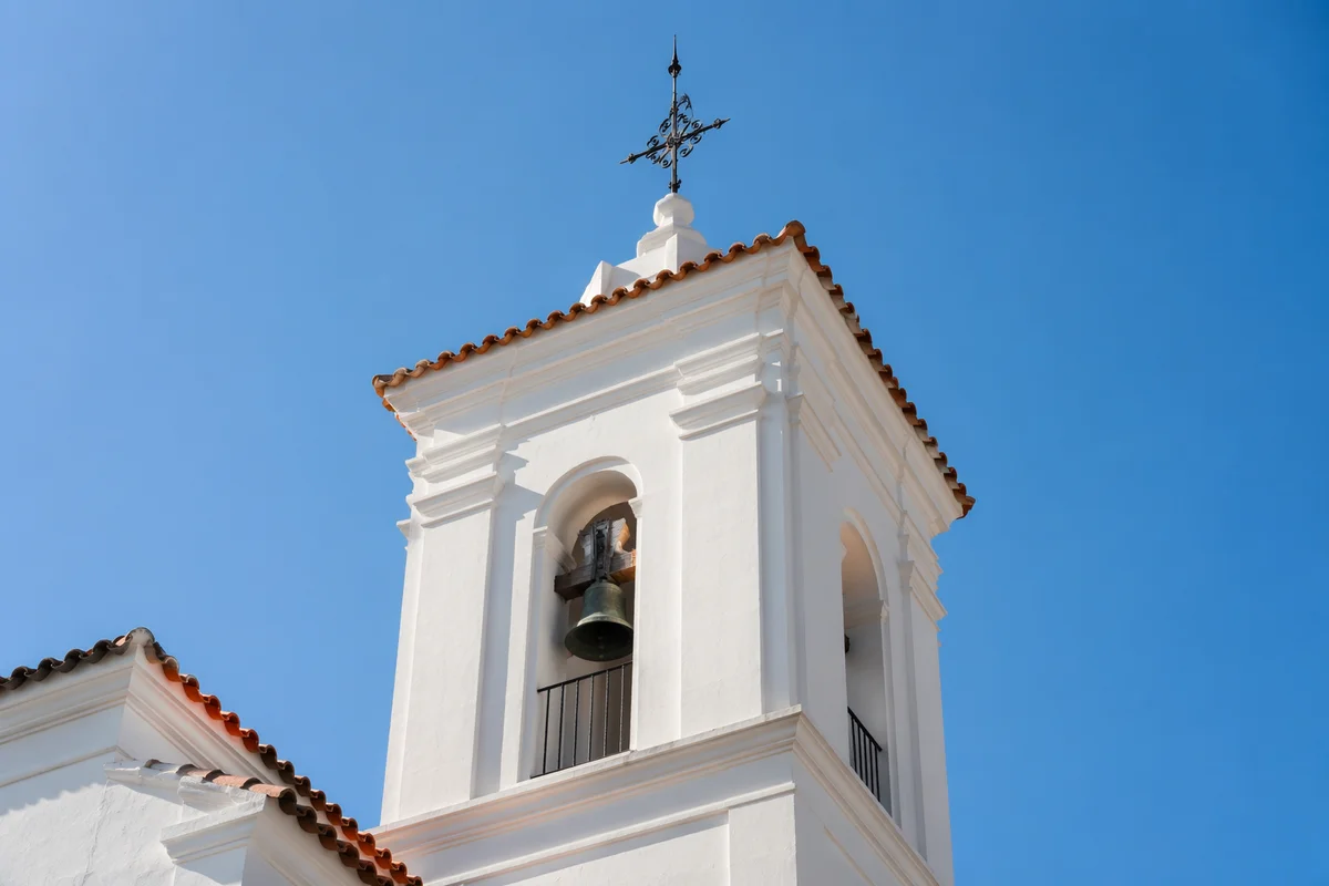 White Church Bell Tower Under Blue Sky