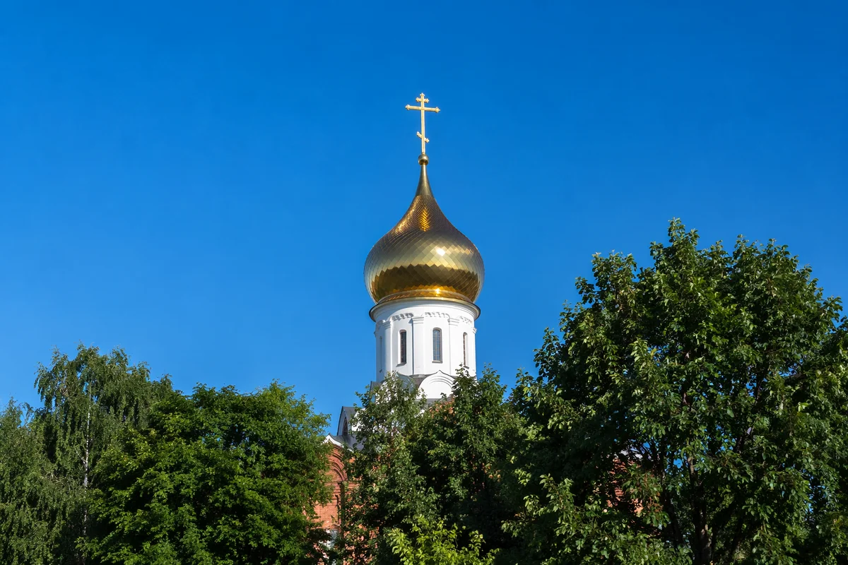 Golden Church Bell Tower Under Blue Sky