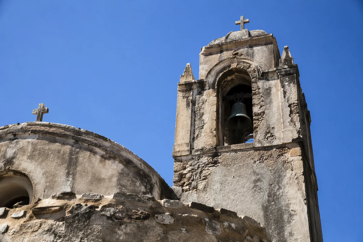 Old Stone Church Bell Tower Under Blue Sky