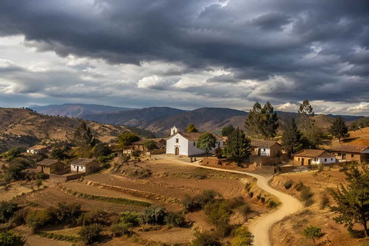 Rural Village Church Beneath Storm Clouds
