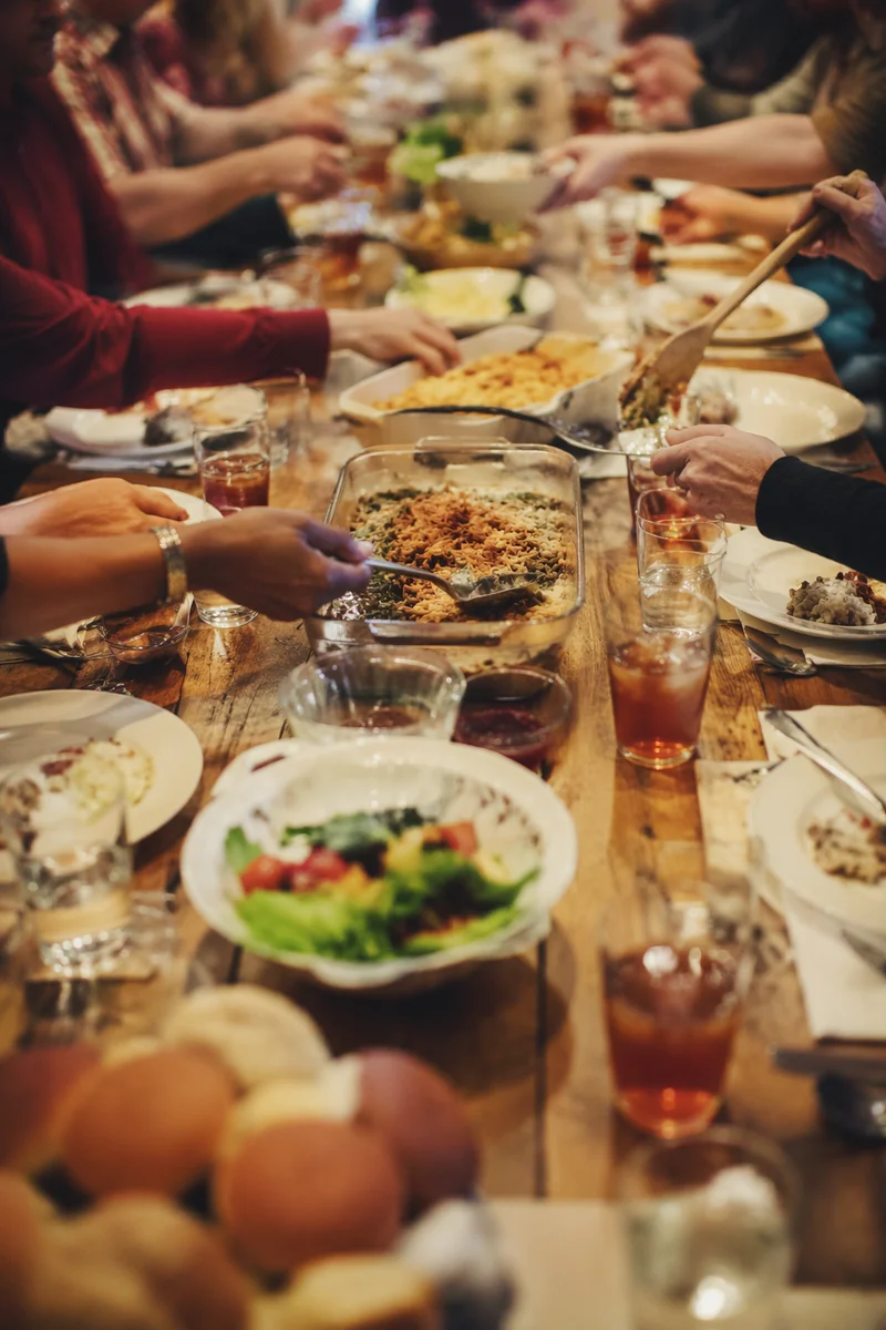 Church Potluck Fellowship Around Shared Table