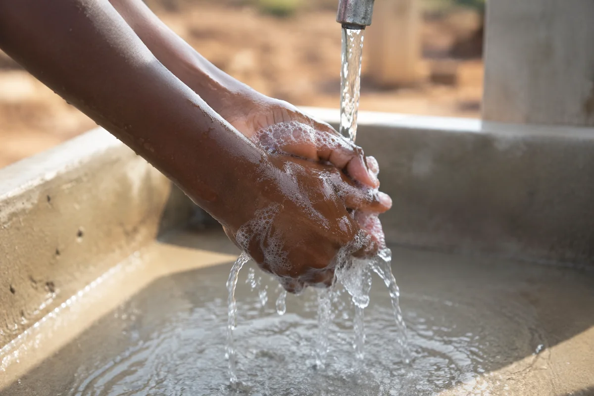 Hands Washed at Village Water Well