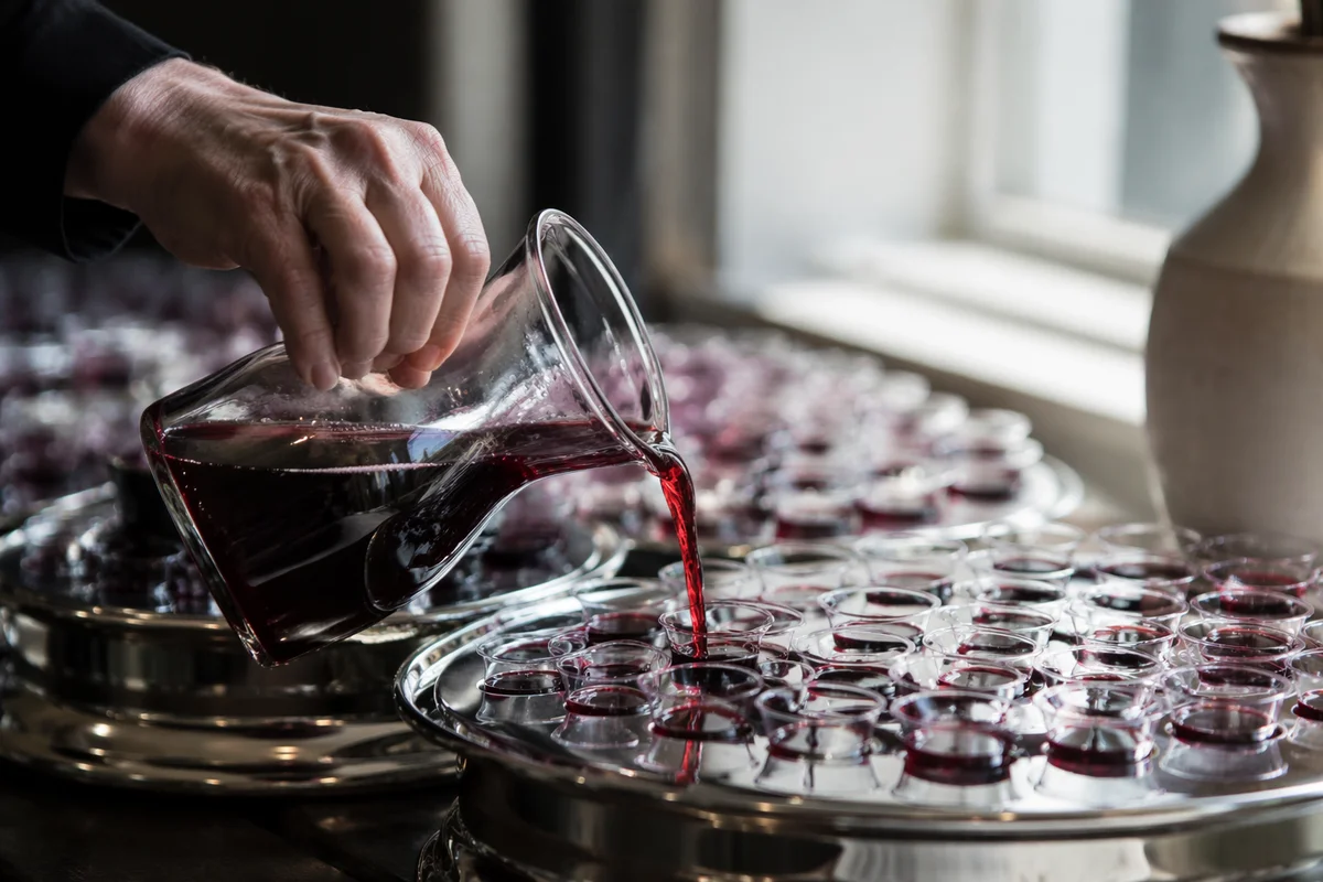 Preparing Communion Cups with Grape Juice