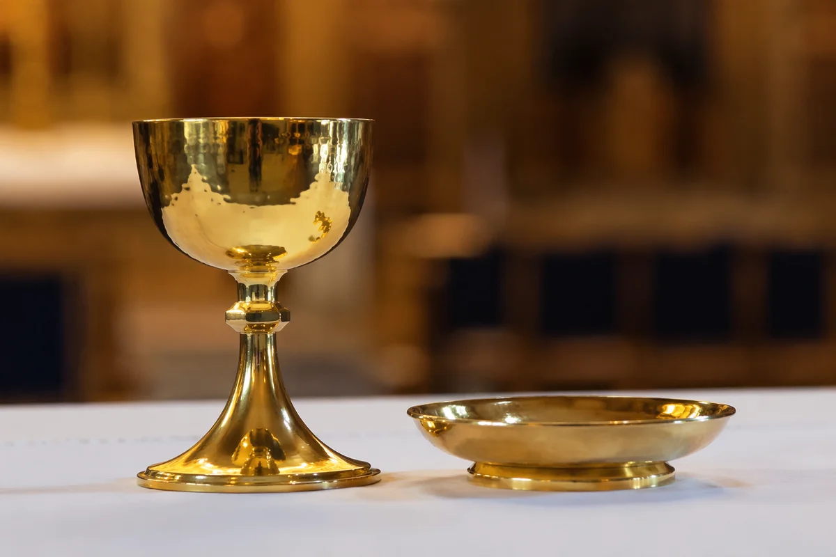 Gold Communion Chalice on White Altar Cloth