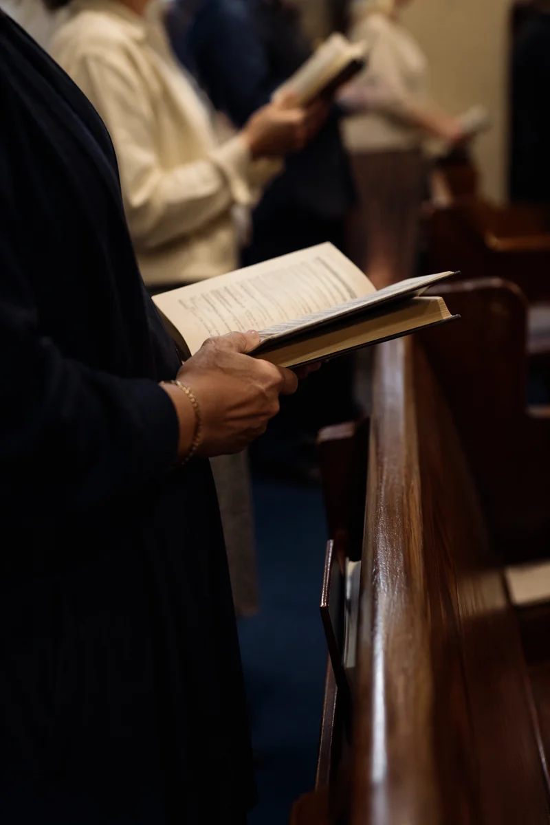 Congregation Singing Hymns in Modest Sanctuary