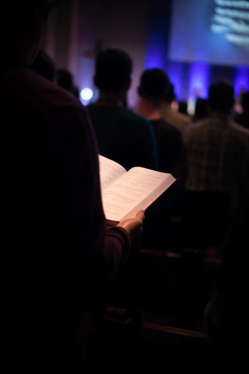 Congregation Singing Hymns in Dim Sanctuary