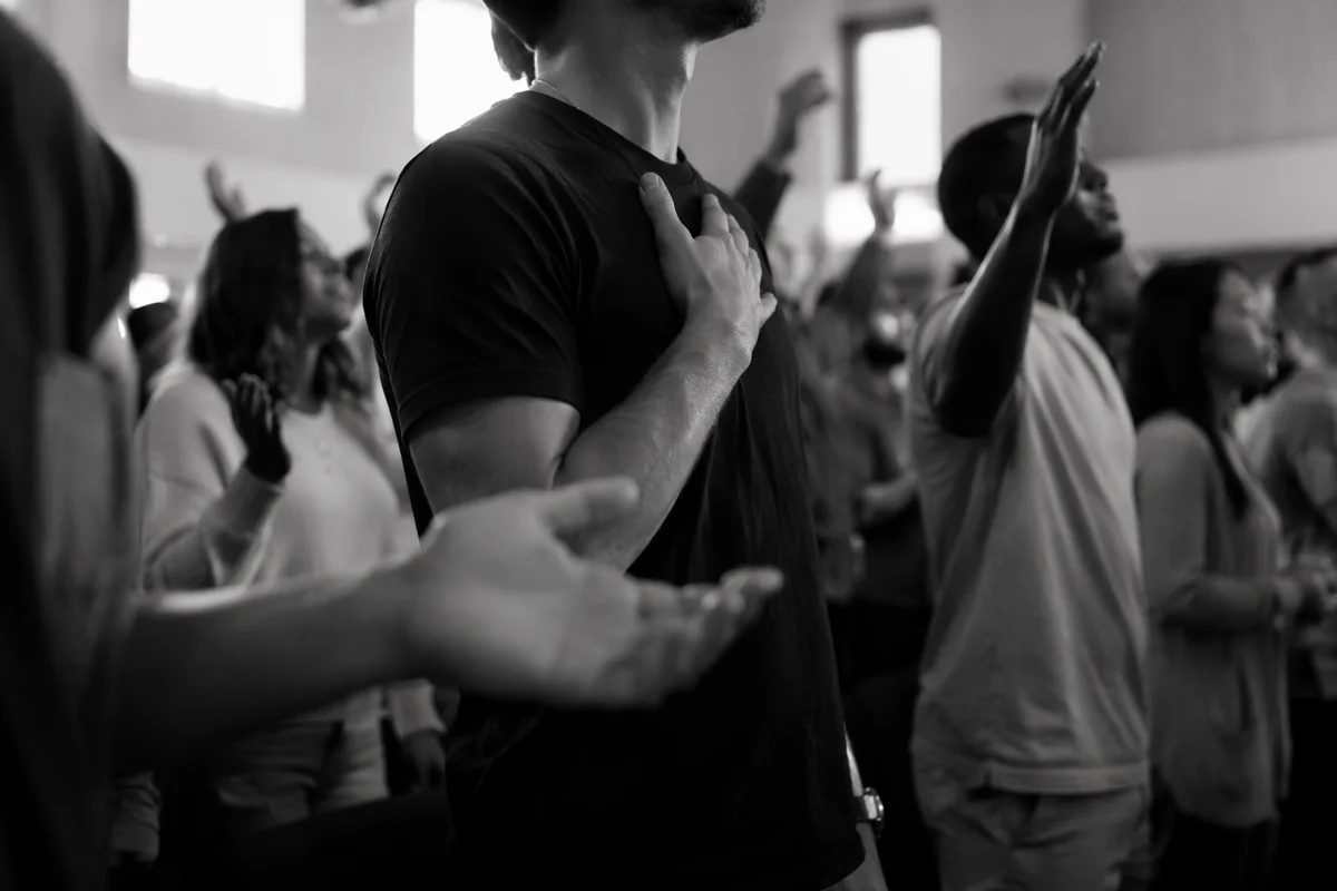 Diverse Congregation Worshiping in Modern Sanctuary
