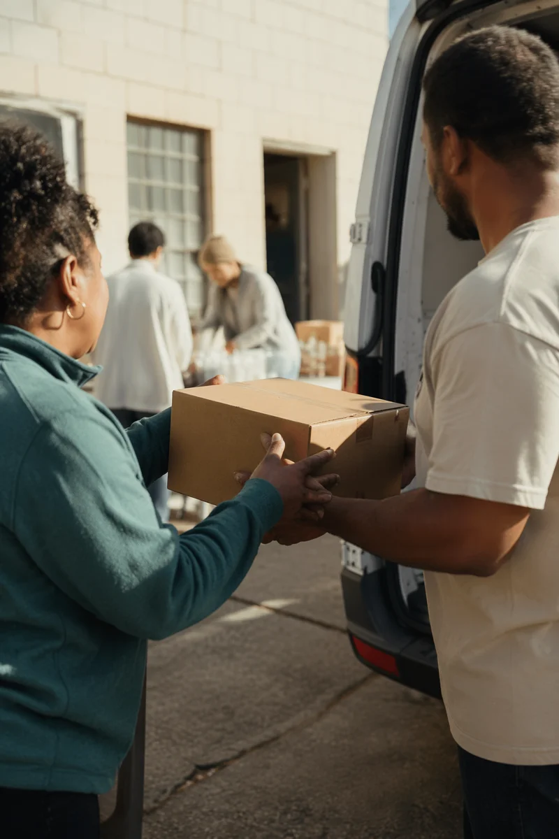 Church Volunteers Sharing Food Outreach Boxes