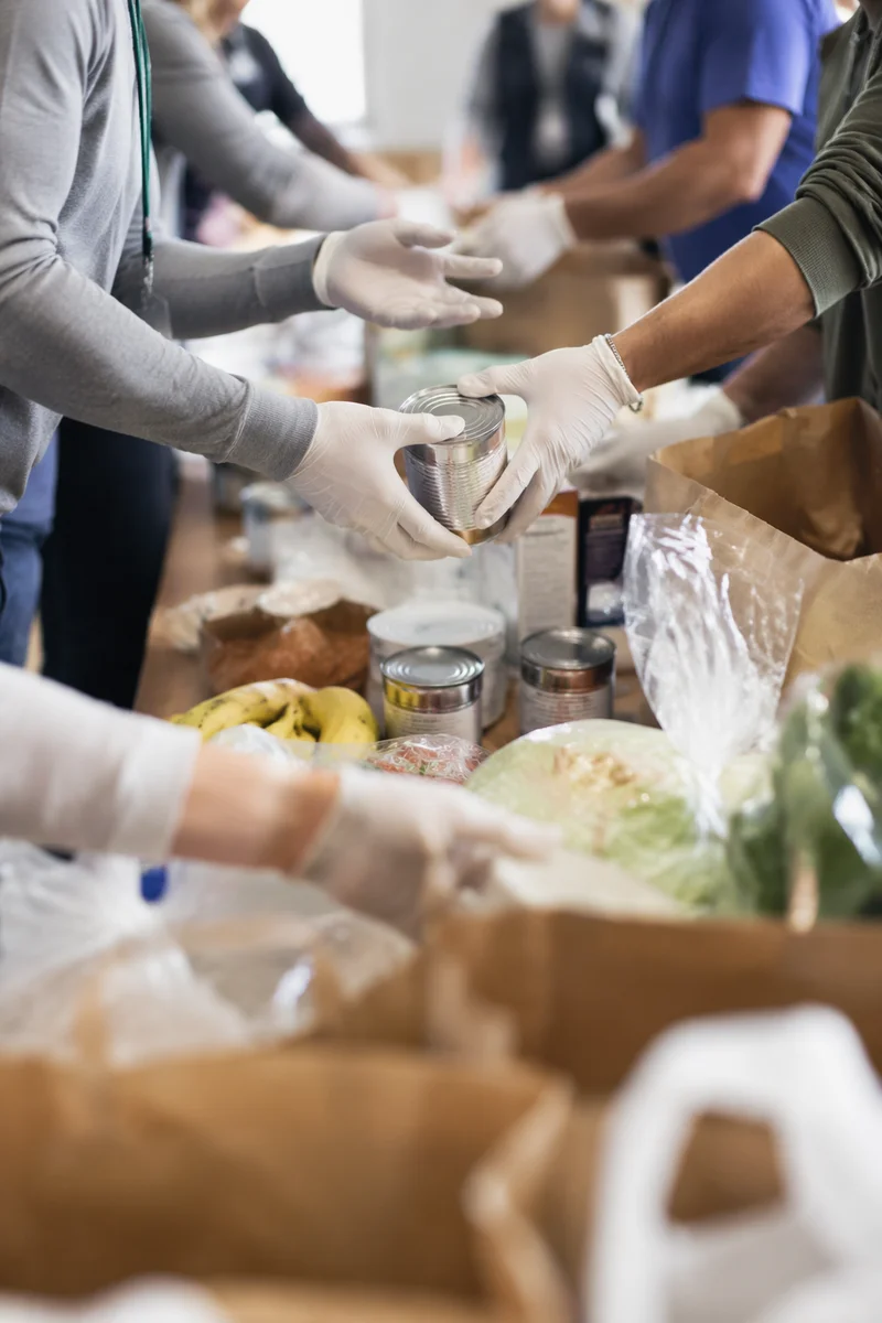 Church Volunteers Sharing Food Outreach Supplies