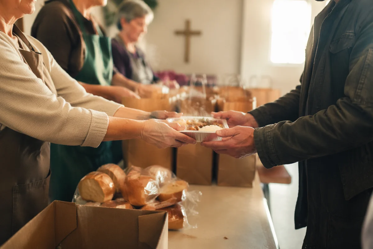 Church Hands Serving Warm Meals with Compassion