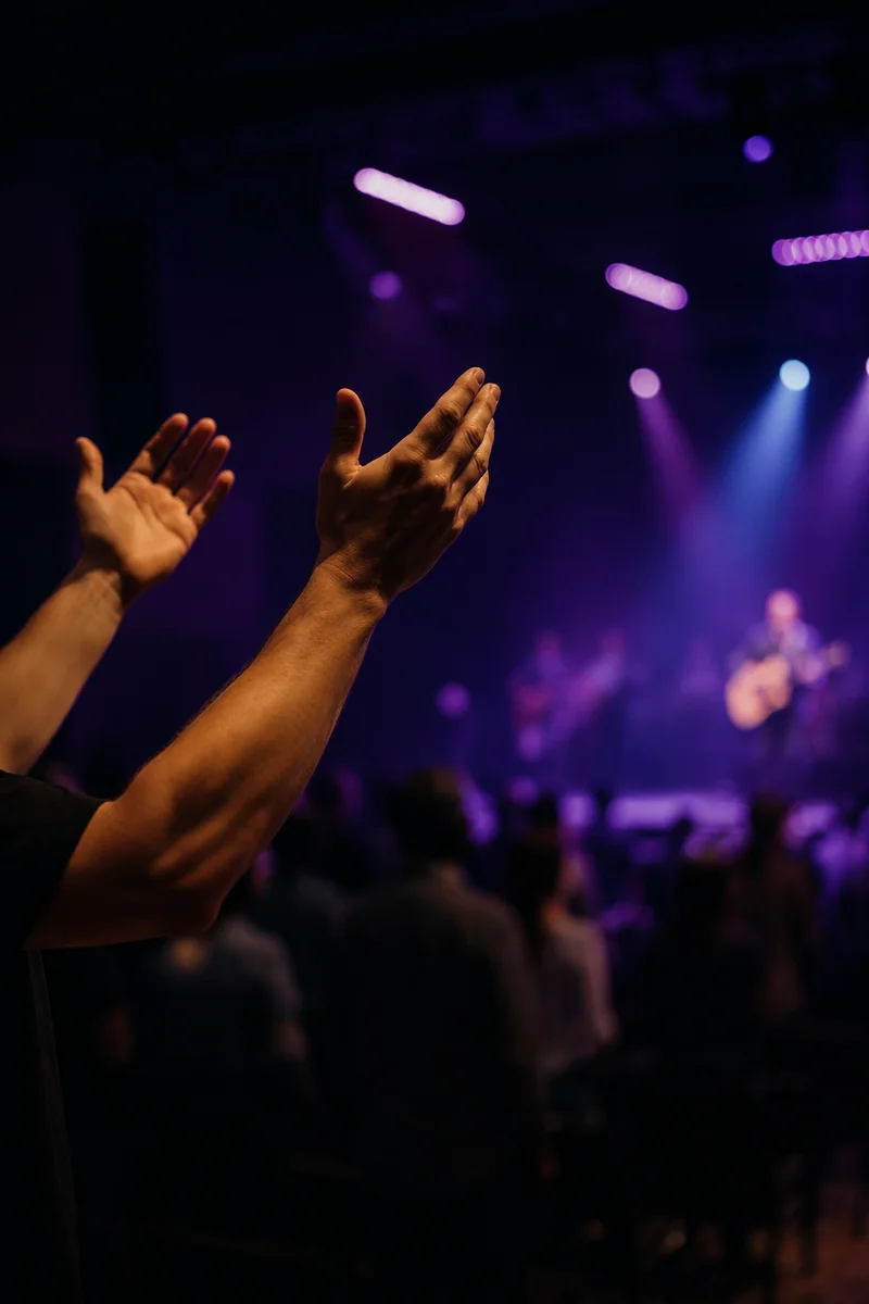 Raised Hands in Worship Concert Lights