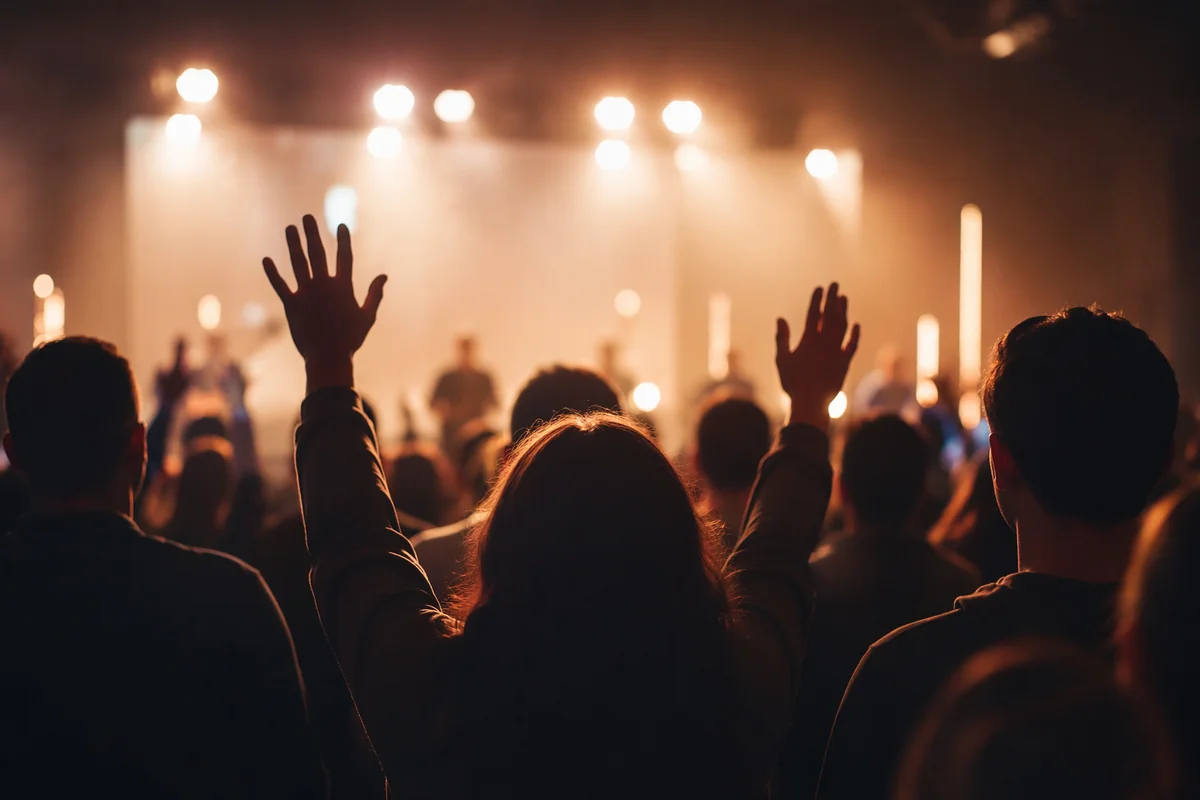 Raised Hands in Warm Worship Lights
