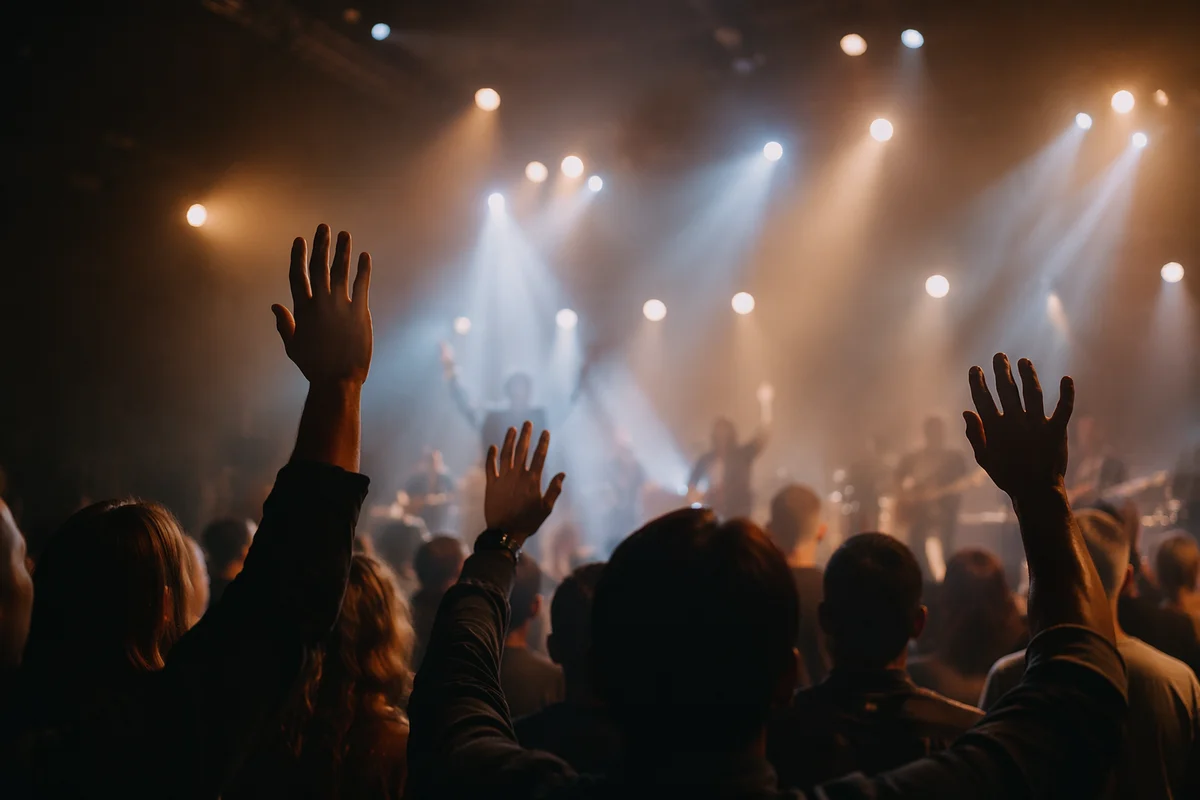 Raised Hands in Worship Concert Lights