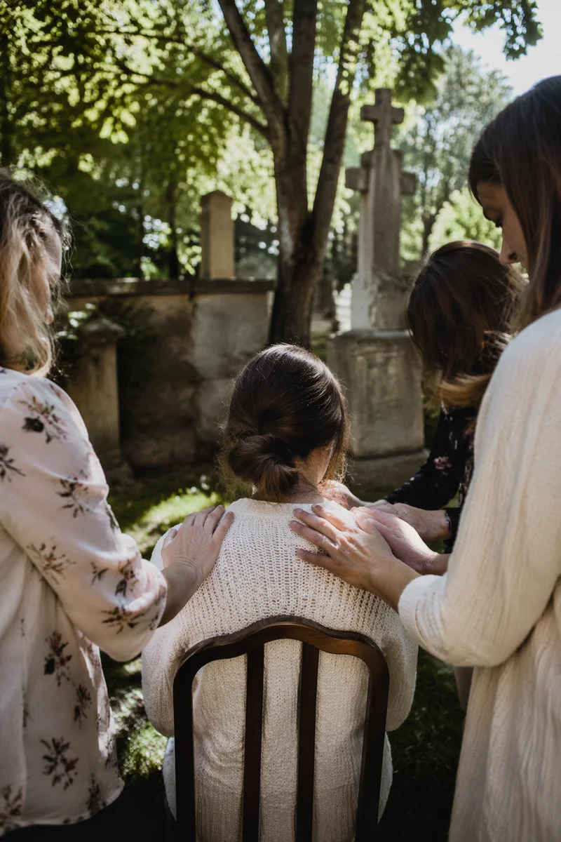 Laying Hands Prayer in Garden Courtyard
