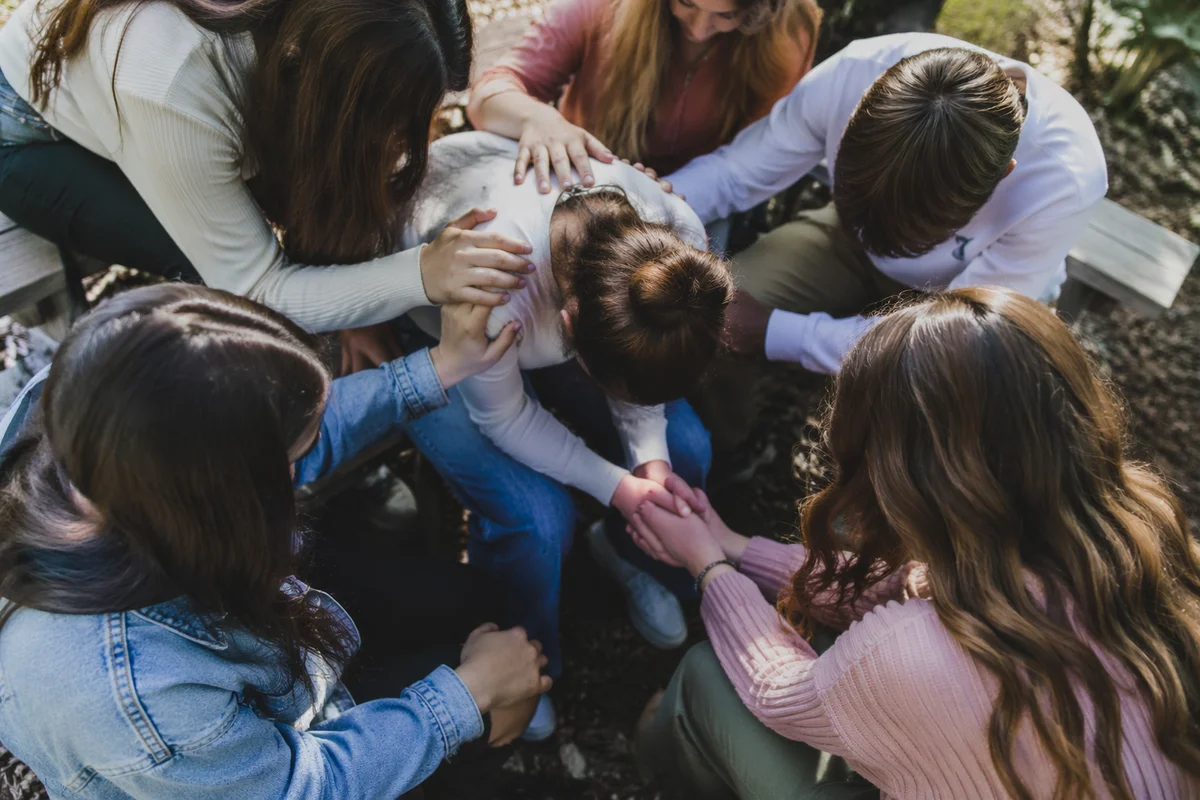 Youth Prayer Circle Laying Hands Outdoors